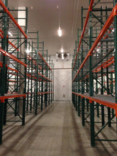 Load image into Gallery viewer, Newly installed pallet racking showing upright frames and beams