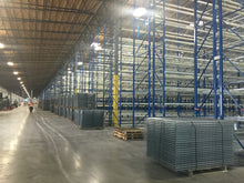 Load image into Gallery viewer, Wire mesh decks for pallet racking inside a large warehouse